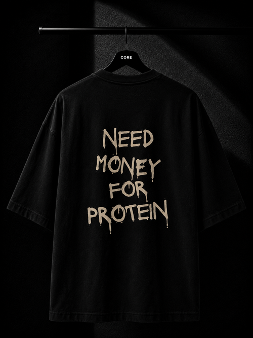 Black oversized T-shirt with a bold "Need Money For Protein" back print in a distressed typography design, displayed on a premium studio hanger.