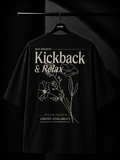 Black oversized streetwear T-shirt with a minimalist white maple leaf graphic cascading from the shoulder on a premium studio mockup.