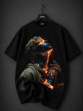 Black oversized graphic T-shirt with a surreal hooded faceless figure featuring glowing molten orange energy and a fiery halo printed on the front.