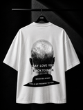 White oversized T-shirt featuring a monochrome back graphic of a shaved head with bold typography in a premium minimalist streetwear design.