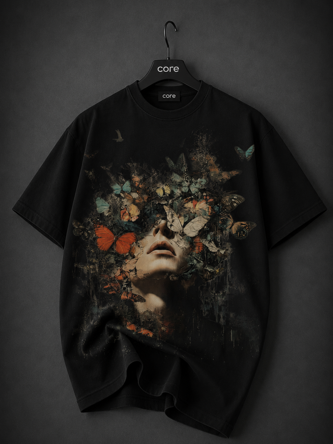 Premium black oversized graphic T-shirt featuring a surreal cracked stone head with a powerful ocean scene flowing through it, creating a dramatic waterfall effect in vivid blue tones on the front.